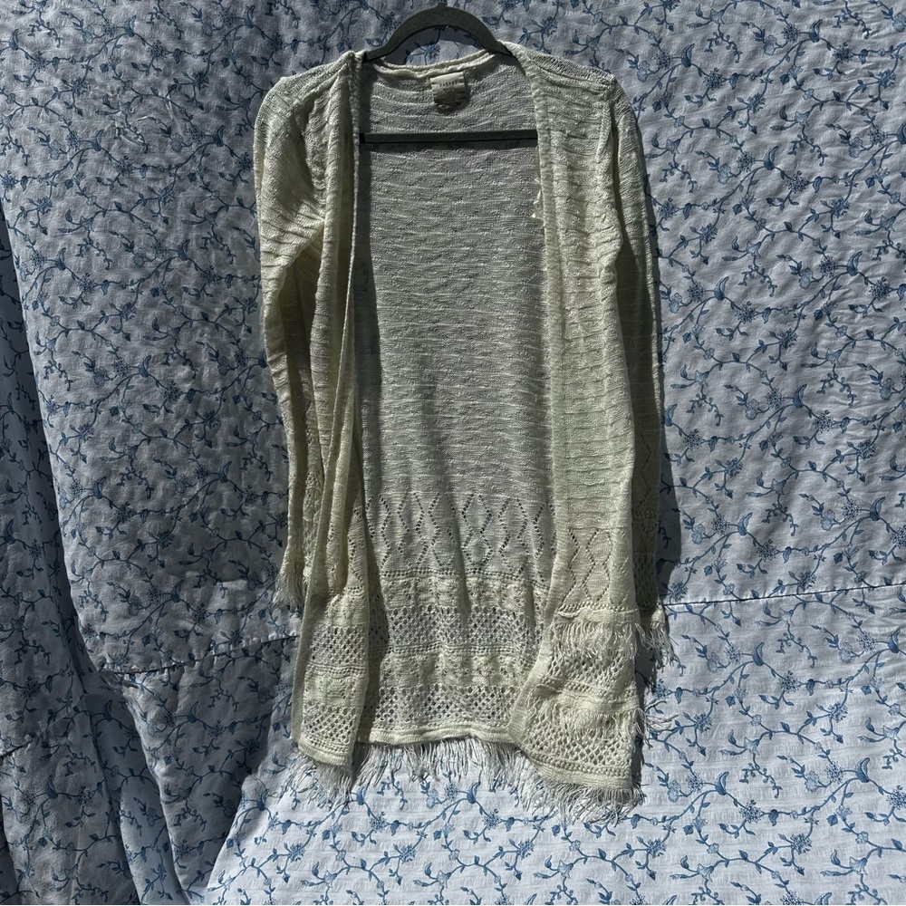 Soft and lightweight cream open front cardigan with fringe details